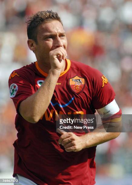 Francesco Totti of Roma celebrates scoring during the Serie A match between Roma and Juventus at the Stadio Olimpico on September 23 in Roma, Italy.