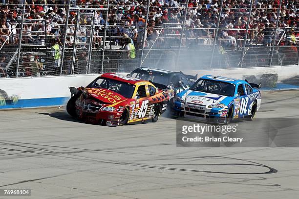 Kyle Petty, driver of the Wells Fargo Dodge, crashes with Denny Hamlin, driver of the FedEx Ground Chevrolet, and Clint Bowyer, driver of the DIRECTV...
