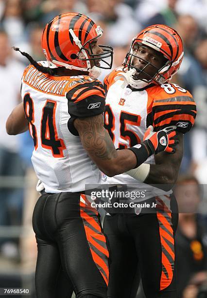 Wide receiver T.J. Houshmandzadeh of the Cincinnati Bengals celebrates with Chad Johnson after scoring a touchdown in the first half against the...