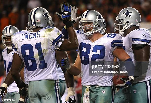 Jason Witten and Terrell Owens of the Dallas Cowboys celebrate after Witten scored a touchdown in the third quarter against the Chicago Bears at...