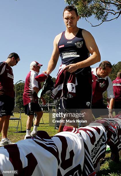 Mark Bryant prepares for a team photo before a Manly Warringah Sea Eagles NRL training session at the Sydney Academy of Sport in Narrabeen on...