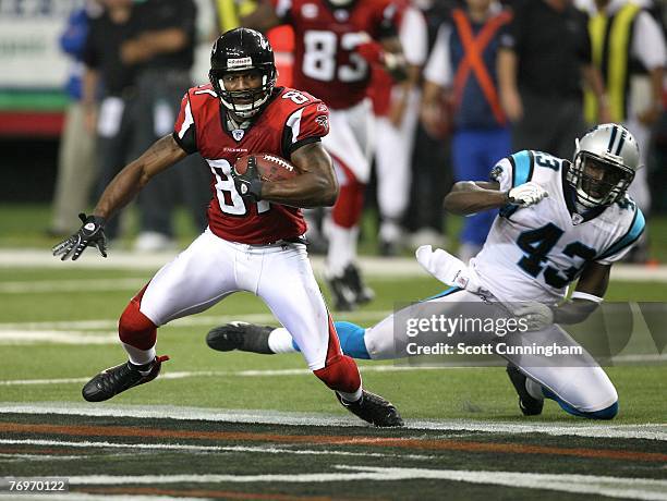 Joe Horn of the Atlanta Falcons runs against Chris Harris of the Carolina Panthers at the Georgia Dome September 23, 2007 in Atlanta, Georgia. The...