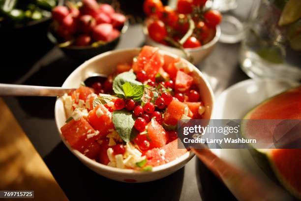 high angle view of fruit salad in bowl on table - fruit salad stock pictures, royalty-free photos & images