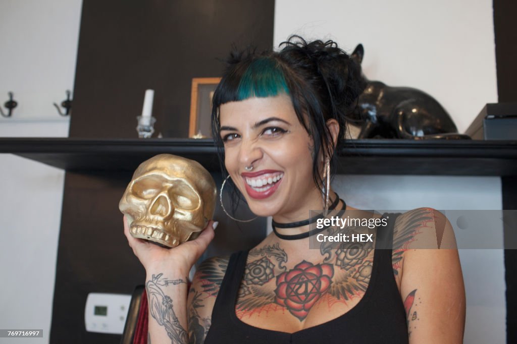 A young woman with a gold skull.