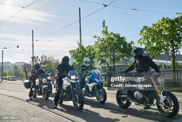 bikers on road - motorcycle group stock pictures, royalty-free photos & images