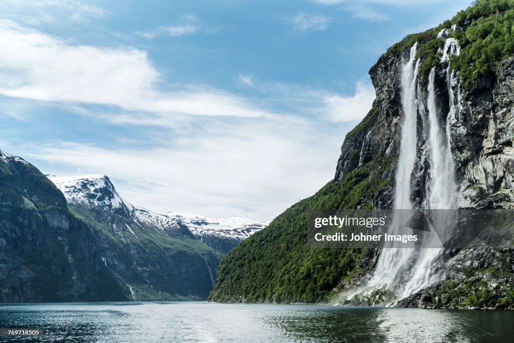 View of waterfall at lake