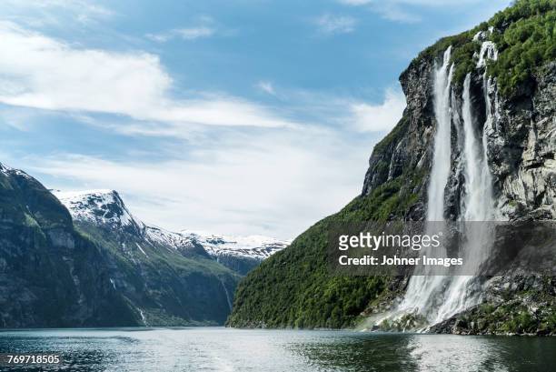 view of waterfall at lake - waterfall fotografías e imágenes de stock