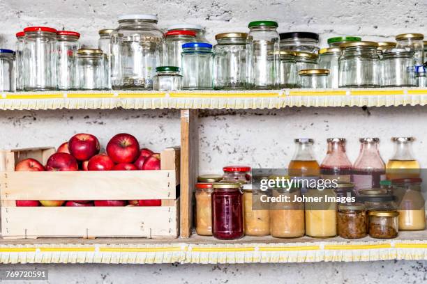 jars and preserves on shelf - marmalade stockfoto's en -beelden