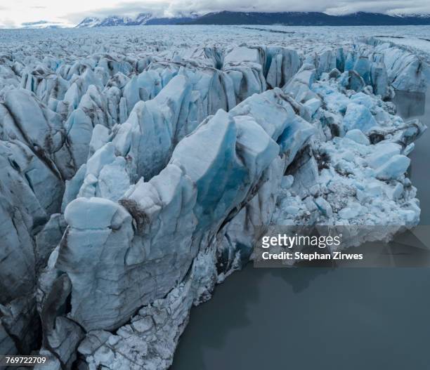 drone view of glacier in lagoon, knik glacier, palmer, alaska, usa - knik glacier stock pictures, royalty-free photos & images