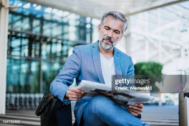 businessman reading newspaper - blank newspaper stock pictures, royalty-free photos & images