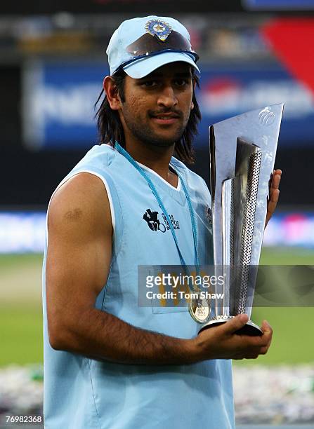 Indian Captain Mahendra Singh Dhoni celebrates with the trophy during the Twenty20 Championship Final match between Pakistan and India at The...