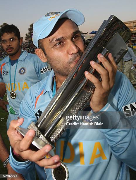 Virender Sehwag of India celebrates with the trophy after the Twenty20 Championship Final match between Pakistan and India at The Wanderers Stadium...