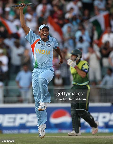 Yusuf Pathan of India celebrates his team's win with Misbah-ul-Haq of Pakistan looking on after the Twenty20 Championship Final match between...