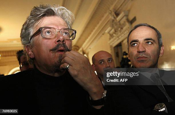 Former world chess champion Garry Kasparov and couter-culture writer Eduard Limonov sit during a meeting of "The Other Russia" party in Moscow, 24...