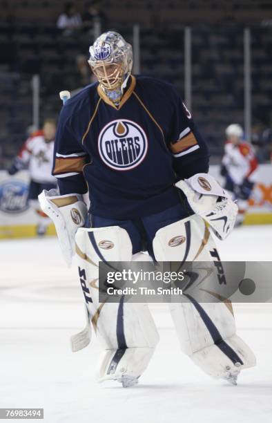 September 17: Goaltender Dwayne Roloson of the Edmonton Oilers skates in warm-ups prior to the start of the preseason NHL game against the Florida...