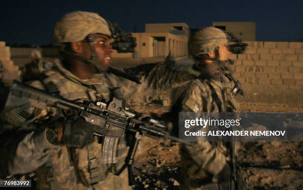 Soldiers from Alpha Company of 1/38 Infantry Regiment patrol an area on the suburbs of Baquba, northeast of Baghdad, late 24 September 2007. A...