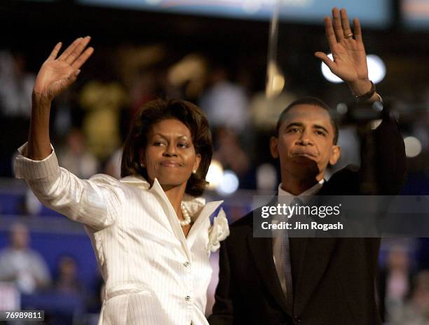 Democratic candidate for the United States Senate in Illinois, Barack Obama and his wife Michelle Obama wave to the crowd at the Democratic National...