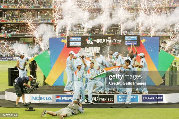 Captain Ms Dhoni looks on as India celebrate their Victory during the final match of the ICC Twenty20 World Cup between Pakistan and India held at...