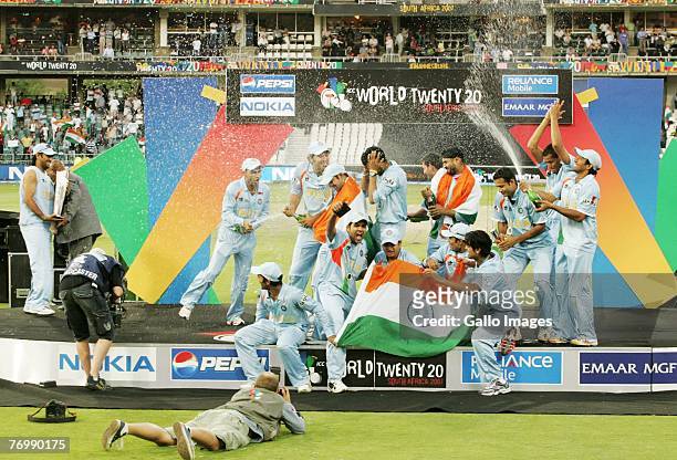 Captain MS Dhoni looks on as India celebrate their Victory during the final match of the ICC Twenty20 World Cup between Pakistan and India held at...