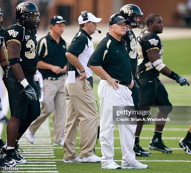 Wake Forest Demon Deacons head coach Jim Grobe watches a replay on the scoreboard during an Atlantic Coast Conference game versus the Maryland...