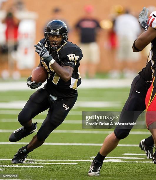 Josh Adams of the Wake Forest Demon Deacons looks for running room versus the Maryland Terrapins at BB&T Field Saturday, September 22, 2007 in...