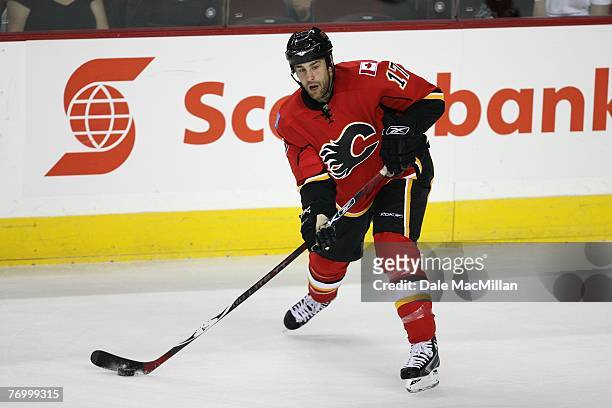 Eric Godard of the Calgary Flames handles the puck against the Florida Panthers at the Pengrowth Saddledome on September 16, 2007 in Calgary,...