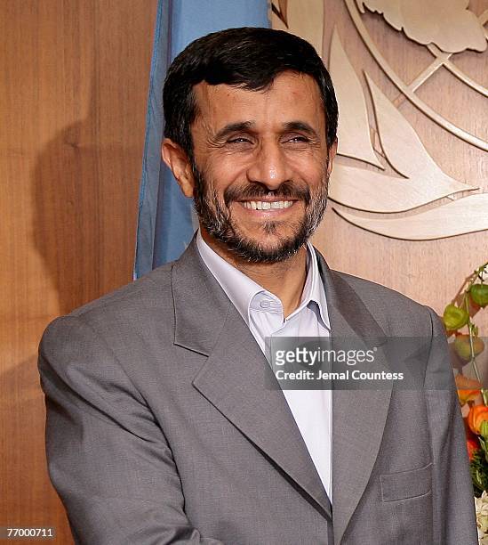 Iranian President Mahmoud Ahmadinejad smiles as he meets with United Nations Secretary-General Ban Ki-Moon during the General Assembly 2007 at the...