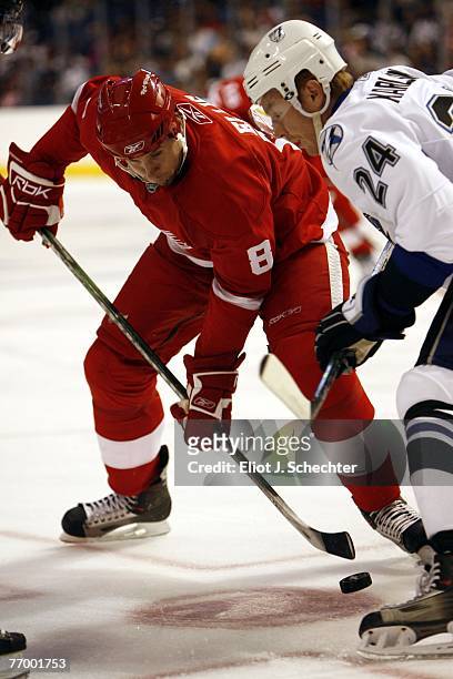 Brad Ference of the Detroit Red Wings faces off against Andreas Karlsson of the Tampa Bay Lightning during a NHL pre-season game at the St. Pete...