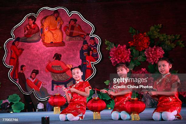 Children perform during rehearsals for a gala to mark the Mid-Autumn Festival on September 24, 2007 in Xian, China. The Mid-Autumn Festival, also...