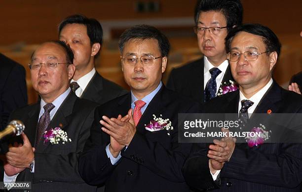 The China Construction Bank Chairman, Mr Guo Shuqing with government officials before trading of the banks shares at the Shanghai Stock Exchange, 25...
