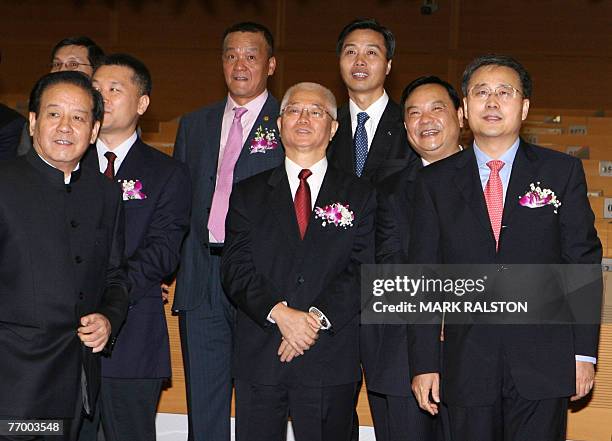 The China Construction Bank Chairman, Mr Guo Shuqing watches the share price with bank and government officials as trading of the banks shares begins...