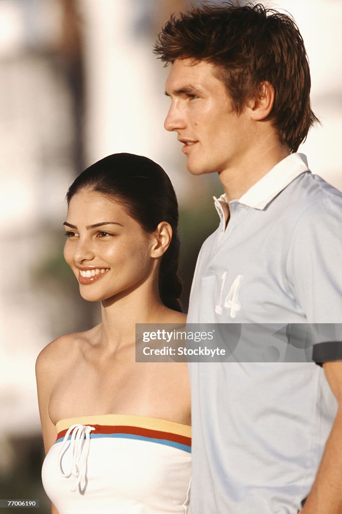 Young couple outdoors, upper half