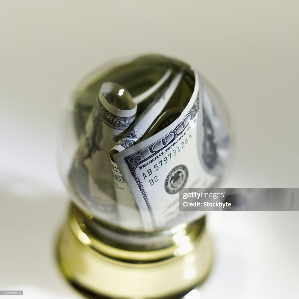 US bank notes in crystal ball