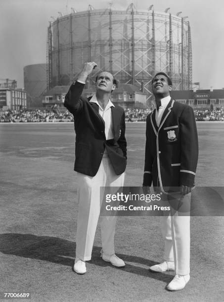 England captain Brian Close and West Indies captain Garfield Sobers tossing up before before the fifth and final test at the Oval, London, 18th...