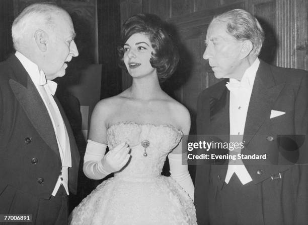 American oil tycoon J. Paul Getty hosts a party at Sutton Place, his Surrey home, 1st July 1960. With him are guests Ian Constable Maxwell and his...