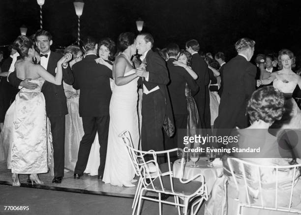 Party at Sutton Place, the Surrey home of American oil tycoon J. Paul Getty, 1st July 1960. The guests dance on the lawn of the mansion.