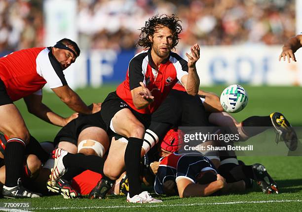 Morgan Williams of Canada passes the ball out during the Rugby World Cup Pool B match between Canada and Japan at the Stade Chaban Delmas on...