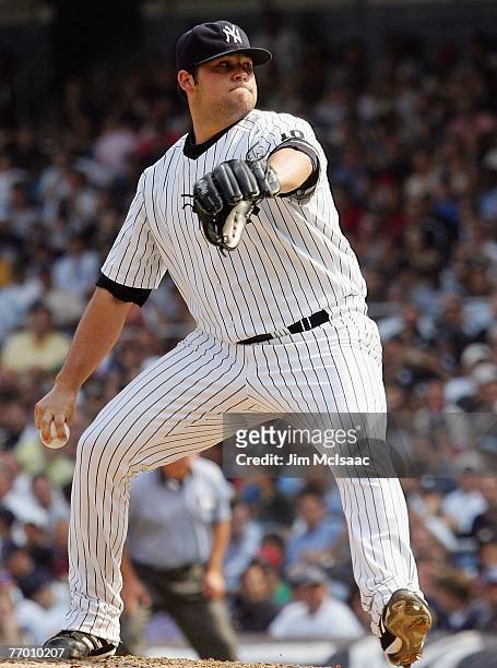 Joba Chamberlain of the New York Yankees deals a pitch against the Boston Red Sox during the game at Yankee Stadium on August 30, 2007 in the Bronx...