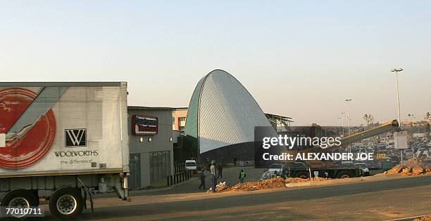 Soweto: shopping heaven comes to anti-apartheid bastion** South African workers are pictured on the site of the new shopping Maponya Mall in Soweto,...