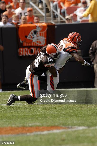 Kick returner Joshua Cribbs of the Cleveland Browns tackles Tab Perry of the Cincinnati Benglas on a kickoff during a game on September 16, 2007 at...