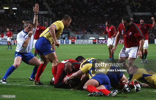 Joaquim Ferreira of Portugal goes over to score the opening try during Match Thirty of the Rugby World Cup 2007 between Romania and Portugal at Le...