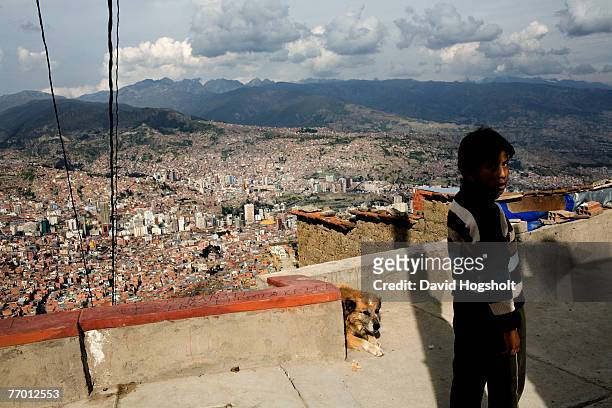 An unidentified Bolivian boy standing outside a house January 31, 2007 in the city of El Alto located on the plateau above La Paz, Bolivia. El Alto...