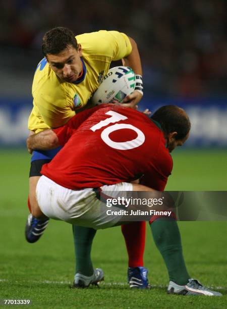 Ionut Dimofte of Romania is tackled by Duarte Cardoso Pinto of Portugal during Match Thirty of the Rugby World Cup 2007 between Romania and Portugal...