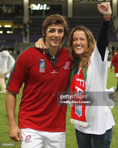 Antonio Aguilar of Portugal poses with his fiancee after she proposed to him after Match Thirty of the Rugby World Cup 2007 between Romania and...