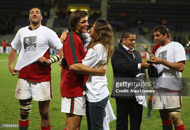 Antonio Aguilar of Portugal embraces his fiancee after she proposed to him after Match Thirty of the Rugby World Cup 2007 between Romania and...