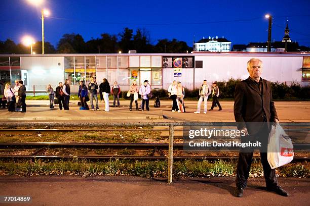 An unidentified drunk, ethnic Russian man waiting for the tram near Tallinn's train station September 17, 2006 in Tallinn, Estonia. Ethnic Russians...