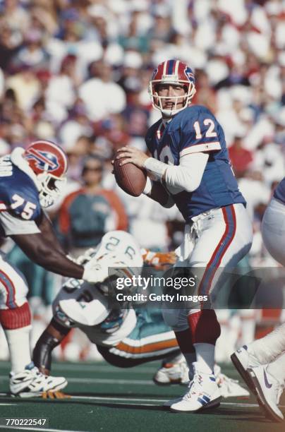 Jim Kelly, Quarterback for the Buffalo Bills prepares to pass during the American Football Conference East game against the Miami Dolphins on 4...