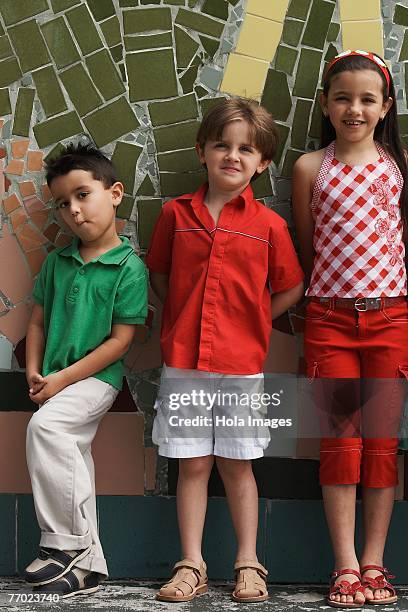 two boys and a girl leaning against a wall - free mosaic patterns photos et images de collection