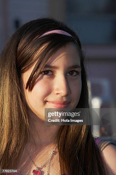 close-up of a girl grinning - heart locket stock-fotos und bilder