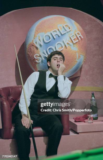 English professional snooker player Ronnie O'Sullivan pictured with a concerned look on his face during competition against fellow English snooker...